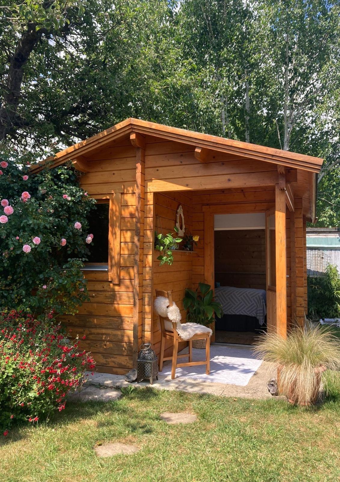 The exterior of the cozy wooden treatment hut.